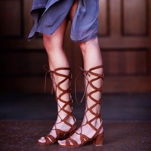 Stuart Weitzman suede knee high gladiator sandal.
